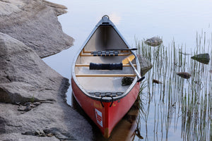 Canoe on calm water.