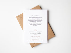 Back of eco-friendly watercolour print of soft, delicate blue flowers with fine brushstrokes and a calming, airy composition.