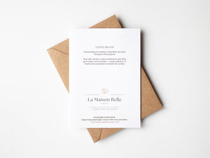 Back of eco-friendly watercolour print of loosely painted tiny blue wildflowers, scattered with a light, whimsical touch.