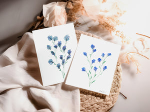 Eco-friendly watercolour print of loosely painted tiny blue wildflowers, scattered with a light, whimsical touch.