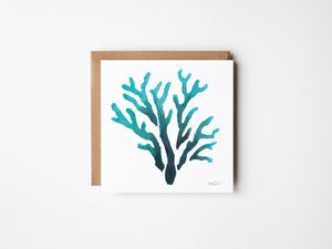 Eco-friendly watercolour print greeting card illustration of vibrant coral with a blend of bright blues and coral hues.
