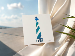 Eco-friendly watercolour print greeting card illustration of a blue lighthouse, symbolizing guidance and strength.