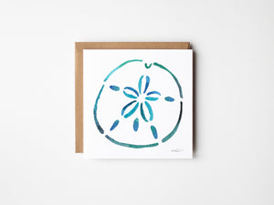 Eco-friendly watercolour print greeting card illustration of a bright blue sand dollar capturing the beauty of the ocean.