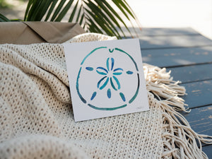 Eco-friendly watercolour print greeting card illustration of a bright blue sand dollar capturing the beauty of the ocean.