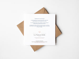 Back of eco-friendly watercolour print greeting card illustration of vibrant cone-shaped shell, capturing the beautiful colours of coastal beauty.