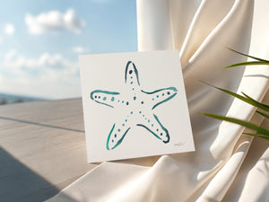 Eco-friendly watercolour print greeting card illustration of vibrant starfish, capturing the bold colours and simplicity of the sea.