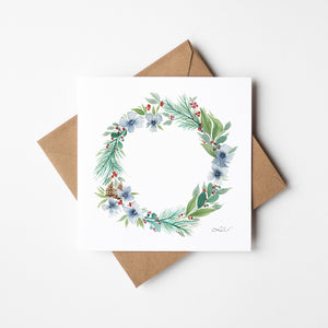 Watercolour illustration of a winter wreath made of cool blues, frosty whites, and soft greens capturing the serene essence of winter, creating a peaceful atmosphere.