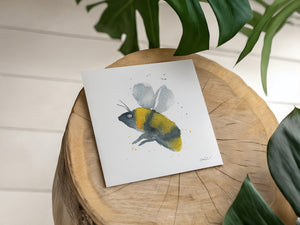 Delicate eco-friendly watercolour print greeting card featuring a detailed honey bee illustration with warm, earthy tones and natural textures.