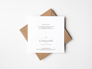 Pink Fortune watercolor greeting card featuring a horseshoe surrounded by pink crepe myrtle blossoms, nature-inspired art on sustainable paper