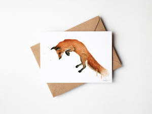 Watercolour illustration of a pouncing fox.