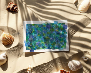 Eco-friendly greeting card featuring a watercolour print of Azure Sea Glass, symbolizing nature's transformation and beauty.