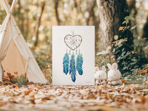 Watercolour greeting card featuring a dreamcatcher with a blue-themed design and a heart-shaped center. The card symbolizes love for nature, water, and the earth with intricate details and calming blue tones.