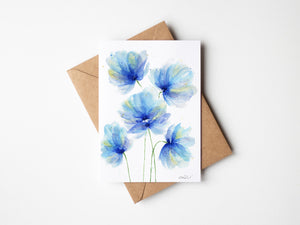 Watercolour greeting card featuring loose, bright blue florals with bold, flowing petals. The design captures the vibrant energy and dynamic beauty of blooming flowers.
