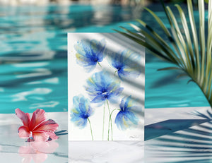 Watercolour greeting card featuring loose, bright blue florals with bold, flowing petals. The design captures the vibrant energy and dynamic beauty of blooming flowers.