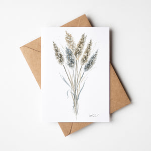 Watercolour greeting card featuring pampas grass in delicate, neutral tones with soft, feathery plumes. The design evokes a sense of calm and boho-inspired beauty, capturing the serene elegance of nature.