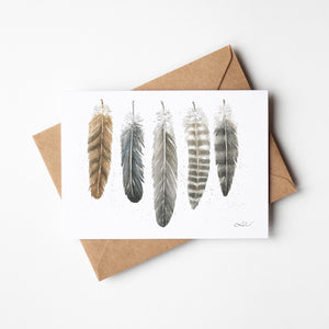 Watercolour greeting card featuring a collection of bird feathers from the North, each with intricate details and natural tones, symbolizing the strength and grace of northern wildlife.