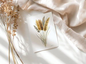 Watercolour greeting card featuring golden cattails with tall, slender reeds and soft brown flower spikes. The design captures the serene and rustic beauty of wetlands and marshes.