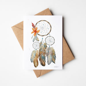 Watercolour greeting card featuring a dreamcatcher with vibrant orange and crimson feathers. The design symbolizes healing, reconciliation, and remembrance, reflecting the connection between tradition and the earth.