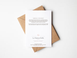 Back of Howling at the Moon wolf greeting card that includes an eco-positive statement.