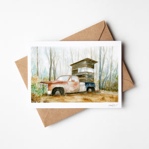 Watercolour greeting card featuring an old truck, Ol' Rusty, converted into a deer stand in a misty field. The design reflects the passage of time as nature reclaims the weathered truck, blending tradition and the beauty of the wild.