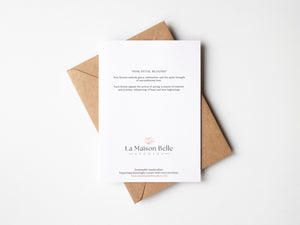 Back of Pink Petal Blooms greeting card which includes an eco-positive statement.