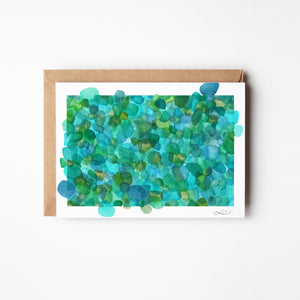 Eco-friendly greeting card featuring a watercolour print of rare turquoise sea glass, symbolizing the ocean’s timeless transformation.
