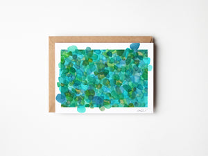 Eco-friendly greeting card featuring a watercolour print of rare turquoise sea glass, symbolizing the ocean’s timeless transformation.