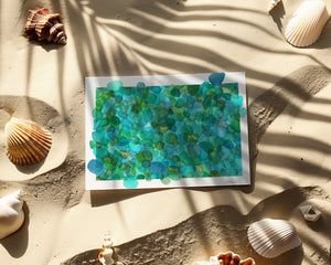 Eco-friendly greeting card featuring a watercolour print of rare turquoise sea glass, symbolizing the ocean’s timeless transformation.