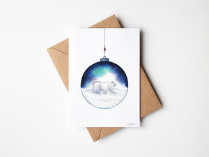 Aurora Polar Bear Greeting Card – Eco-friendly greeting card featuring a delicate watercolour illustration of a polar bear inside an ornamental ball, with the Aurora Borealis in the background.