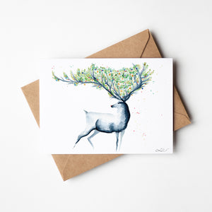 Christmas Reindeer Greeting Card – Eco-friendly greeting card featuring a hand-painted watercolour illustration of a reindeer in a wintry landscape, capturing the festive spirit.