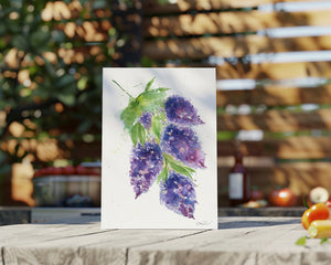 Eco-friendly watercolour greeting card, Whispering Lilacs, featuring a loose watercolour painting of delicate lilacs in soft shades of lavender and purple, with a dreamy, flowing design evoking calm and tranquility.