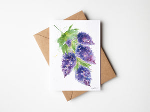 Eco-friendly watercolour greeting card, Whispering Lilacs, featuring a loose watercolour painting of delicate lilacs in soft shades of lavender and purple, with a dreamy, flowing design evoking calm and tranquility.