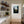 Fine art photography print featuring a lone lighthouse against Iceland's rugged coastal scenery.