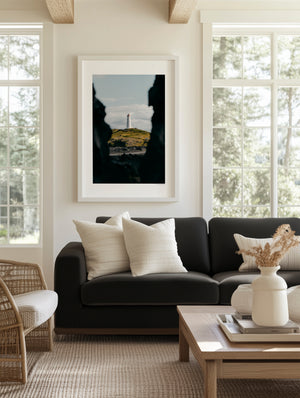 Fine art photography print featuring a lone lighthouse against Iceland's rugged coastal scenery.