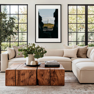 Fine art photography print featuring a lone lighthouse against Iceland's rugged coastal scenery.