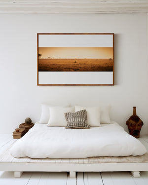Cheetah resting alone in Central Serengeti National Park, Tanzania — surrounded by soft light and open space. Fine art wildlife print evoking solitude and quiet beauty.