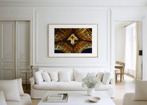 Fine art photograph of the Eiffel Tower at night, highlighting the star-shaped pattern of lights beneath its structure.