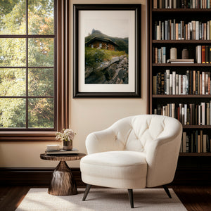 Dreamy hidden wooden cabin beneath a mountain in Norway, moody fine art landscape photography print.