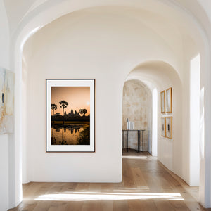 Fine art landscape photograph with warm luminous tones and soft reflection, creating a serene, atmospheric and subtly mysterious composition.