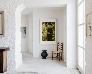 Minimal fine art photograph of a garden post, highlighting soft curves, texture, and subtle shadows in a calm, natural setting.