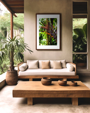 Fine art photograph of ember-toned palm fronds blending into green rainforest foliage, highlighting colour harmony, texture, and tropical natural beauty.