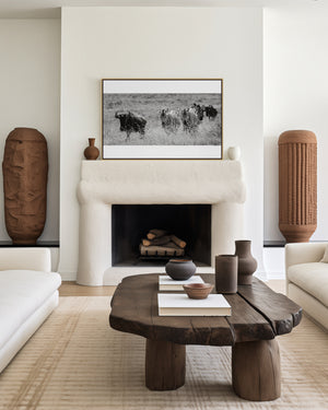 A mixed group of zebras and wildebeest walking together across the grasslands of Ngorongoro Conservation Area, captured in a fine art wildlife photograph.