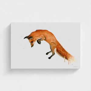 A vibrant watercolour painting of a fox mid-leap, capturing its playful energy and graceful movement. The artwork showcases delicate brushstrokes and vivid colours, highlighting the fox’s elegant form against a soft, natural background.